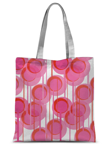 This Mid-Century Modern style tote design consists of colorful geometric circular shapes in various tones of pink, connected vertically by narrow tentacles to form and almost hanging mobile type abstract circular pattern on a white background