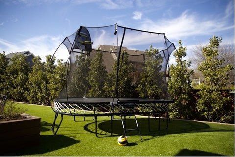 A Springfree Trampoline in a backyard.