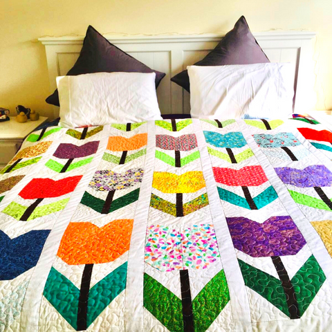 Totally Tulips quilt in its new home - photo courtesy of @NetteP