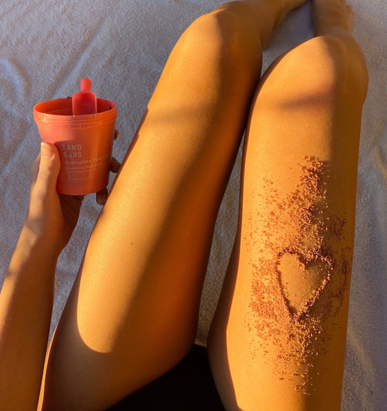 girl with body scrubs on legs