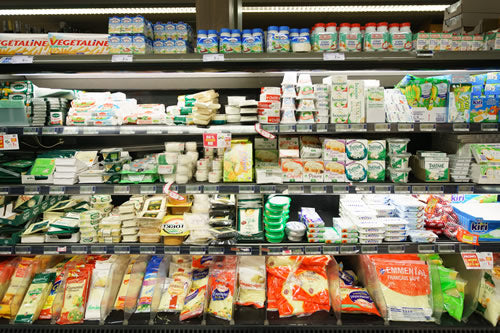 The cheese case at a typical Parisian grocery store.