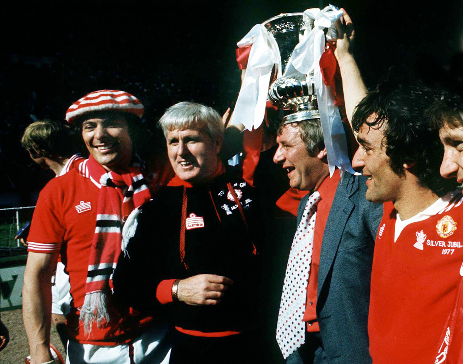 1977 FA Cup Final: Man Utd 2 Liverpool 1 Football - 1977 FA Cup Final .Wembley Manchester United v Liverpool.  Tommy Docherty (Manager) and Tommy Cavanagh Coach / trainer with the trophy. Stuart Pearson (left). Lou Macari - right.