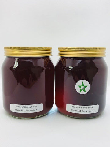 Two jars of dark honey - 3rd prize at National Honey Show 2023
