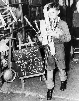 Black and White photograph of a boy buying fireworks