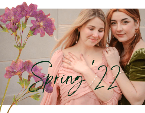Two women hugging, showing off matching bracelets, with the text over saying "spring 22"
