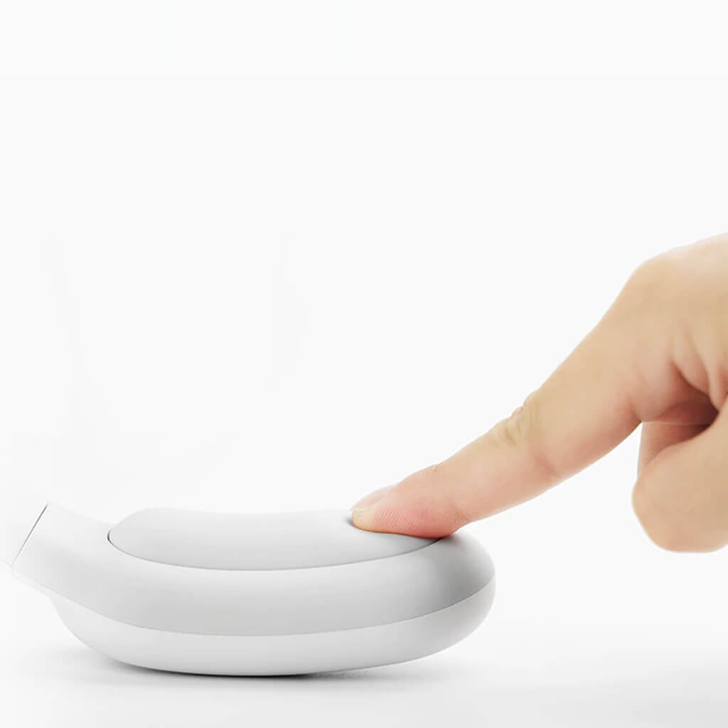 Neck massager being touched by finger on soft foam