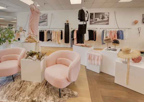 image of the interior of the inlarkin flagship boutique in santa ynez showing the clothing designed by mary beth larkin