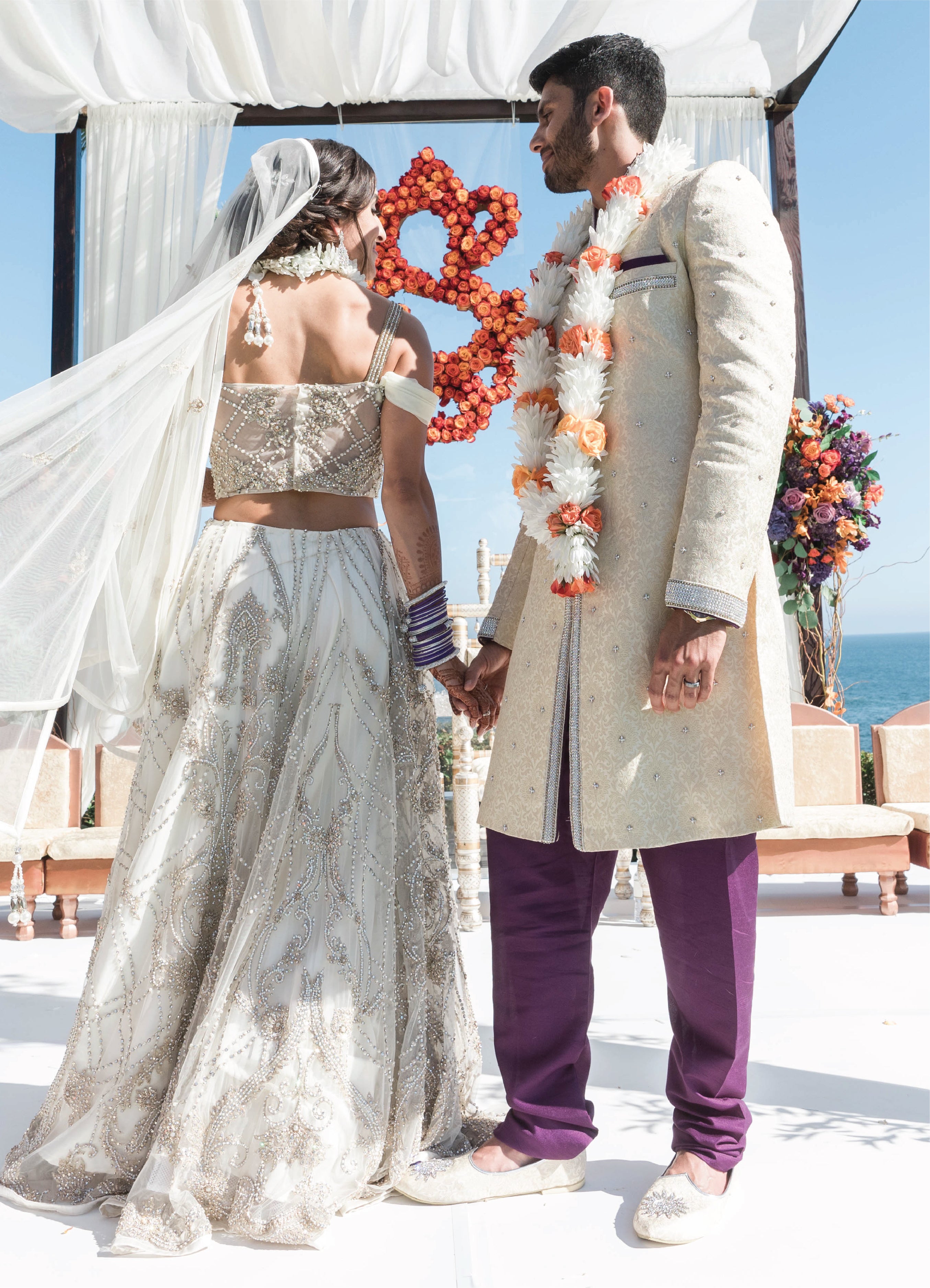 Indian Bride And Groom In A Coordinated Maroon Velvet Wedding Lehenga And  Sherwani | Indian wedding lehenga, Indian bride and groom, Indian bride