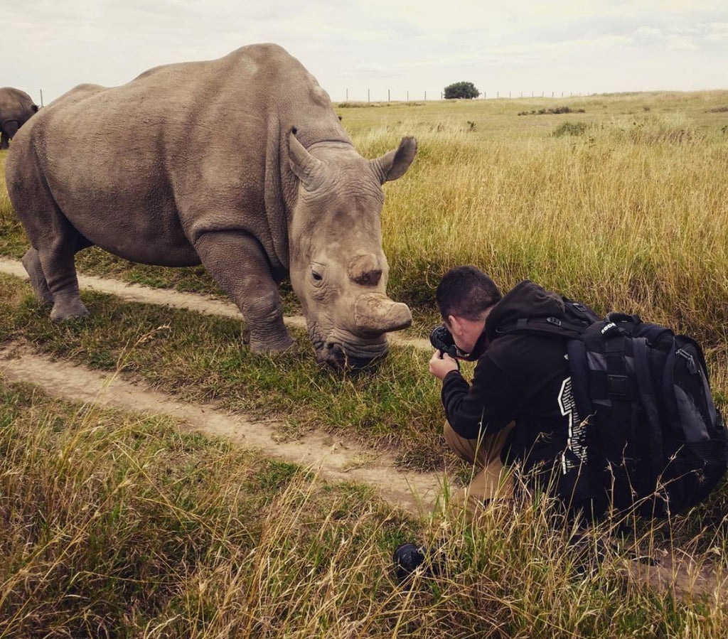 Jamie Lucas photographing rhino