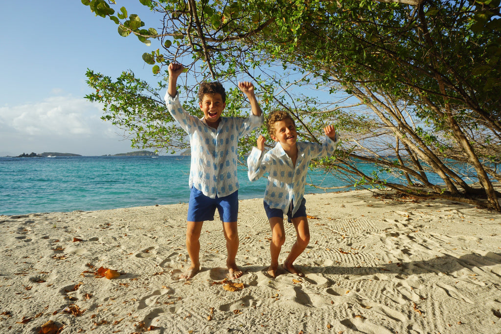 Children in beetle print linen shirts by lotty b for pink house mustique