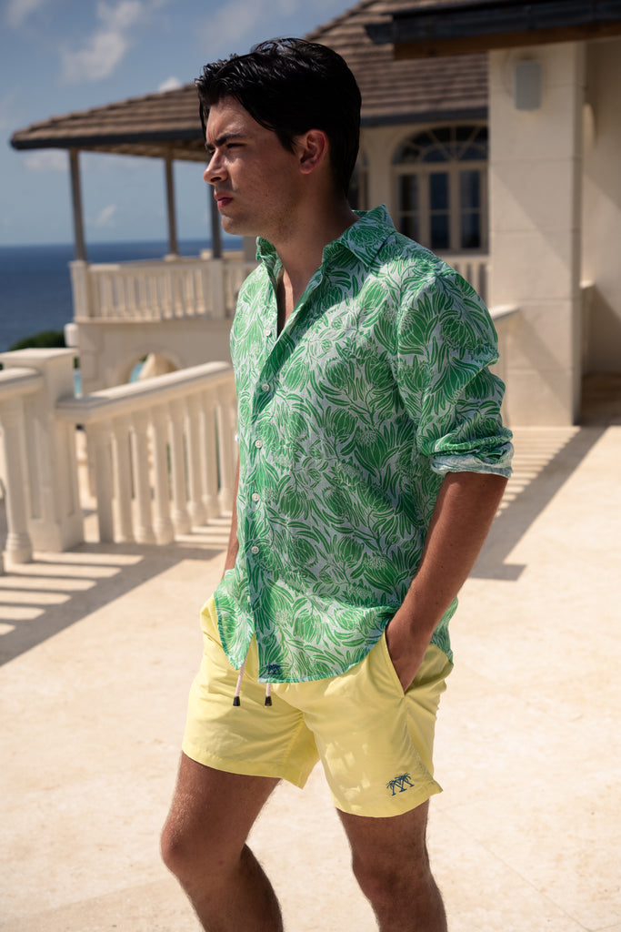 Protea green on pale blue linen shirt with yellow swim shorts