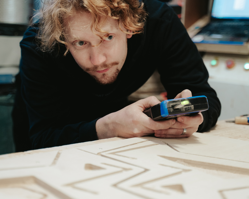 person operating cnc machine