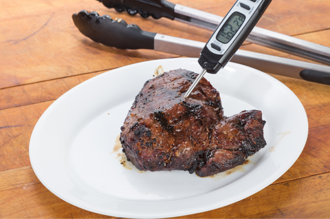 Digital Meat Thermometer in a Grilled Steak