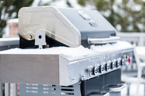 Stainless steel grill in frozen ice