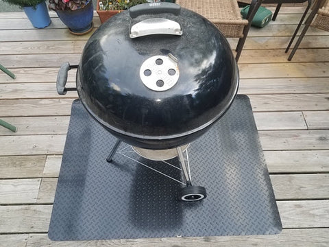 Charcoal Grill Sitting on a Wooden Deck