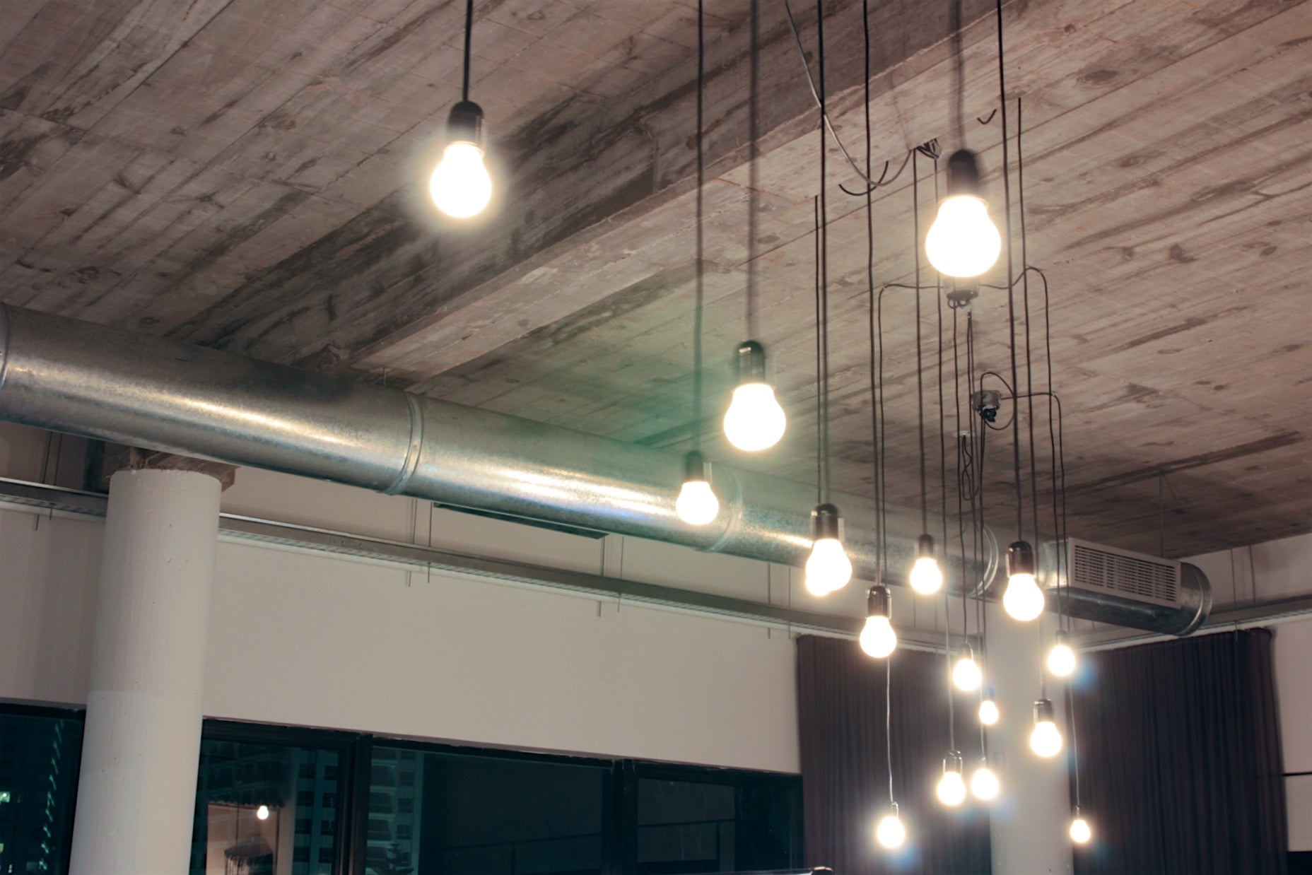 Custom Industrial Light Fixture Design for an industrial designed office space.