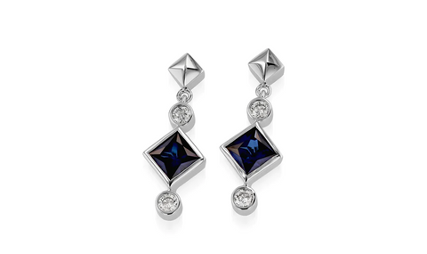 woman wearing 5 year anniversary sapphire earrings