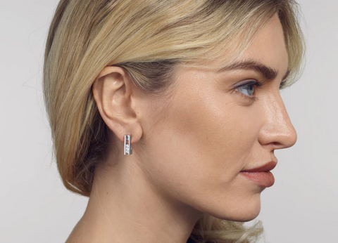 woman wearing diamond hoop earrings