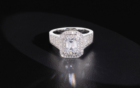 photo of an emerald cut diamond ring by John Atencio