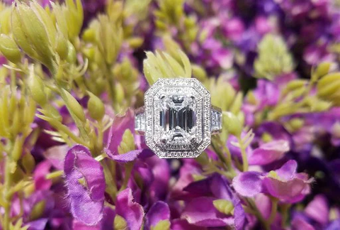 woman wearing an emerald fancy shape engagement ring