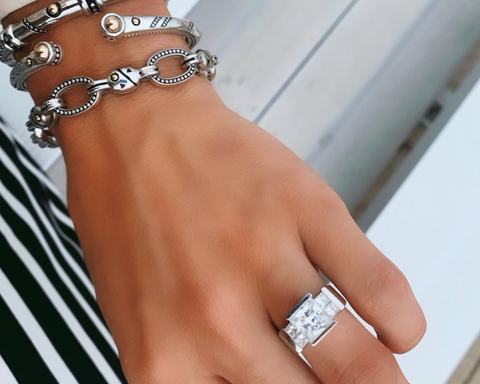 woman wearing a square cut engagement ring upgrade