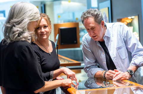 John Atencio with customers at his store showing engagement ring styles