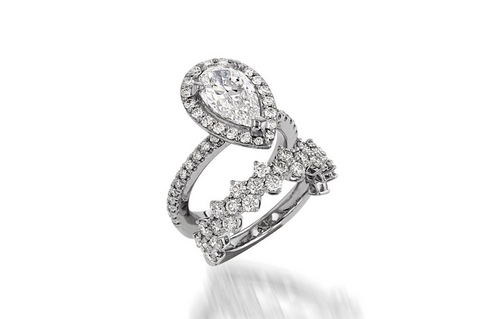 photo of a pear cut engagement ring with pave diamonds by John Atencio