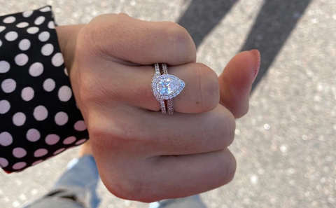 woman wearing an pear fancy shape engagement ring