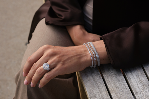 woman wearing diamond tennis bracelets