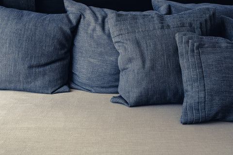 Denim cushions arranged next to each other.