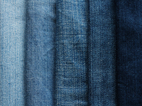 A close-up shot of five shades of denim fabric