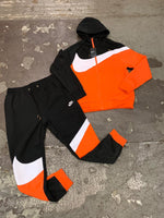 orange and white nike sweatsuit 