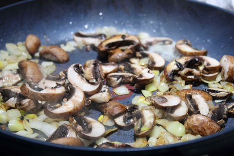 Pan with onions and champignons