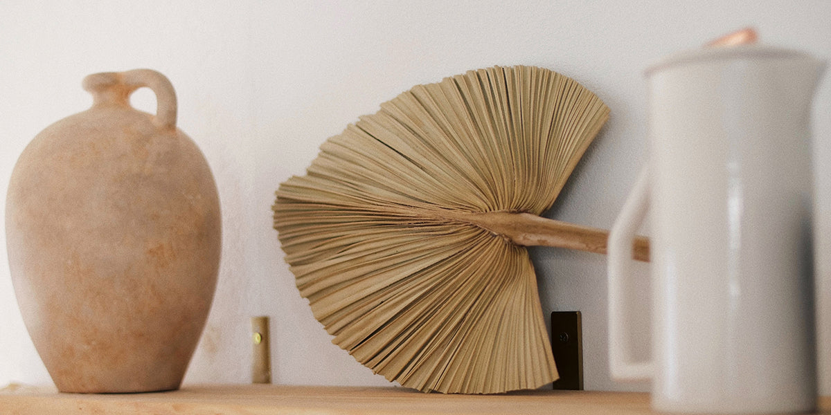 Brown Wooden Table Decor with palm leave fan and jar