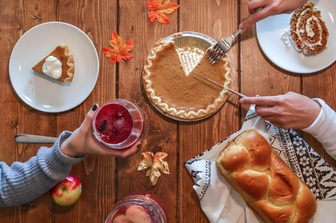 thanksgiving 2020 table hands pumpkin pie