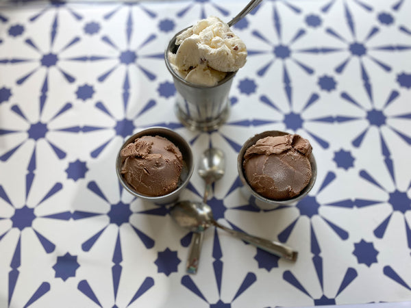 mint julep cups with ice cream in them and spoons