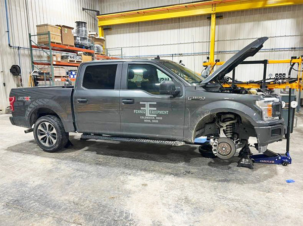 Fennig Equipment pickup truck on lift