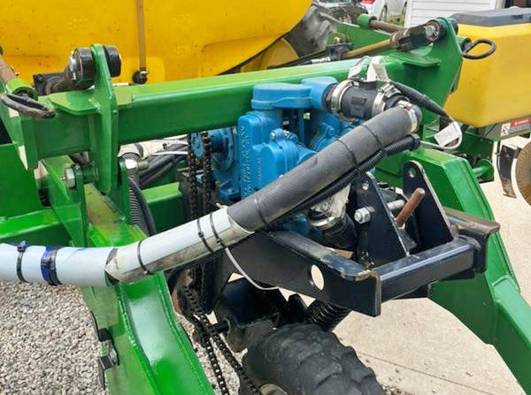 John Blue Piston Pump on a used Farm King liquid Applicator