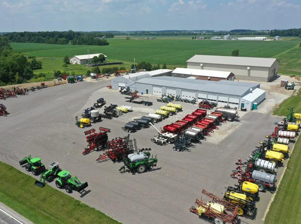 parking lot with farm equipment
