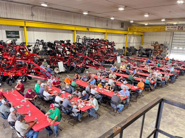 farmers sitting at tables in shop