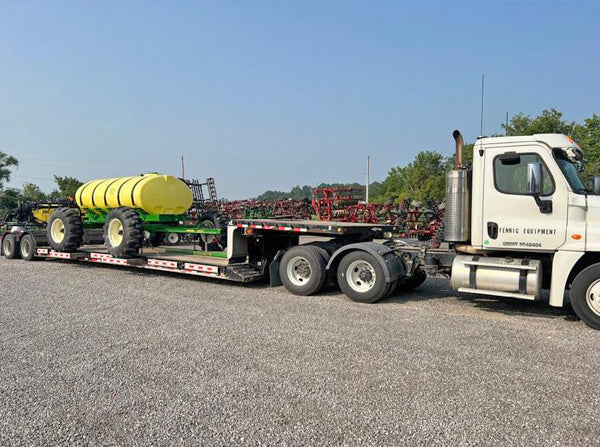 Yetter all steer fertilizer cart on a trailer