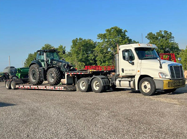 Duetz tractor on trailer