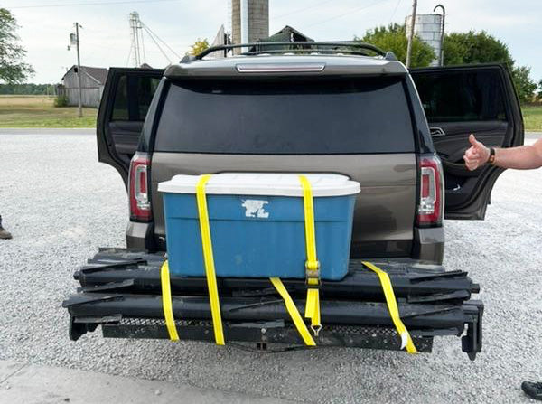 Yetter Devastator rollers strapped to luggage rack on car