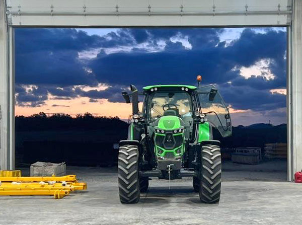 sunrise behind a Deutz tractor