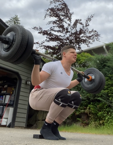 High-bar squats in our driveway.