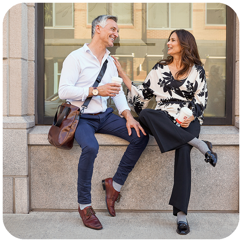 couple smiling at each other wearing linen compression socks