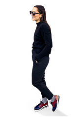 woman wearing stylish outfit and Sigvaris Style Microfiber Patterns compression socks in the color Mariner Stripe
