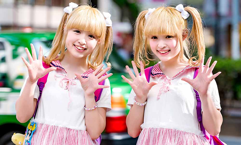 Two Japanese Kawaii school girl dressed with cute outfit. These two twins have pigtails, a backpack and Kawaii accessories in their hair