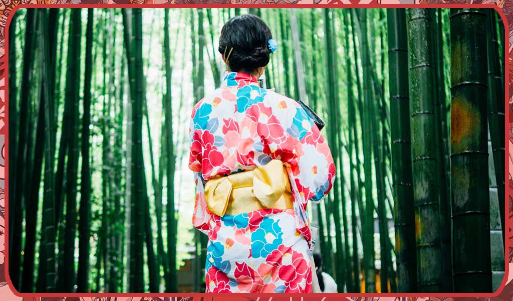 A geisha wearing a bow of women Obi knot with a flower kimono