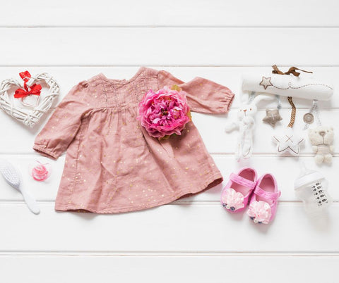 baby clothes and flowers